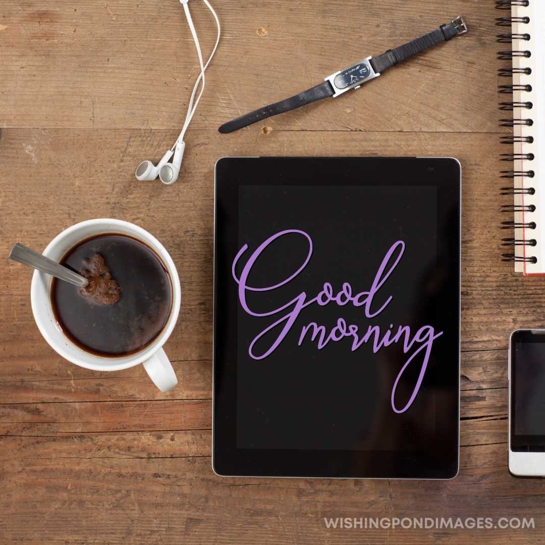 Morning coffee, tablet computer, phone and notebook on the table
